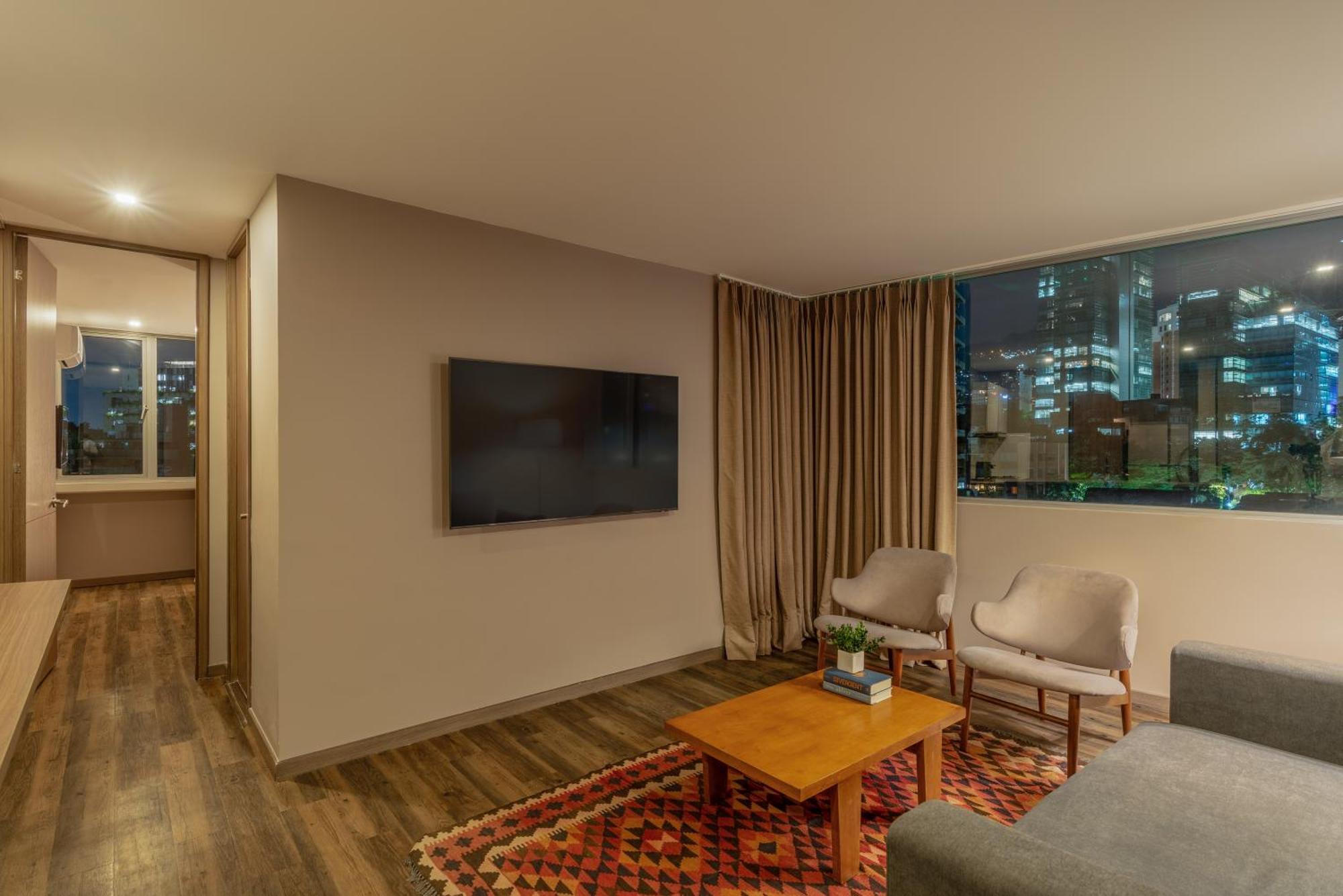 Sites Hotel Медельин Экстерьер фото A living room in a modern apartment